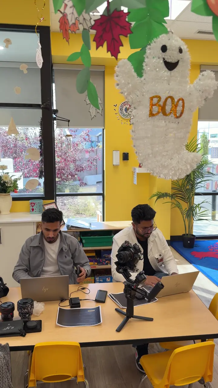 Third Eye team working on laptops and a camera rig inside a client day care